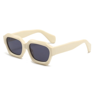 Modern creamy white chunky sunglasses with thick frames and dark grey lenses for street style