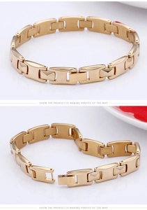 Detailed view of gold stainless steel rectangular link bracelet with secure folding clasp