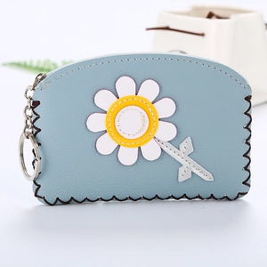Close-up of light blue PU leather coin purse featuring a daisy motif and silver keychain