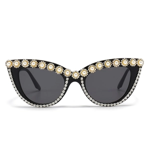 Luxury cat-eye sunglasses with rhinestone floral patterns and pearls on black frames