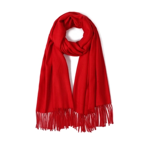 Close-up of soft red cashmere-feel scarf texture with elegant fringe details