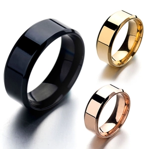 Polished stainless steel rings in black, gold, and rose gold with a mirror finish