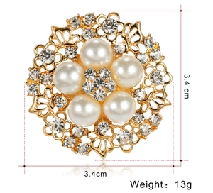 Detailed view of floral pearl brooch with gold finish, 3.4cm diameter, weighing 13g