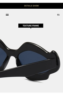 Close-up of black sunglasses with unique wavy textured frames and dark lenses