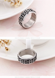 Detail view of 304 stainless steel ring showing intricate black oil drip woven texture