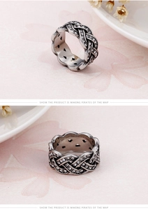 Macro detail of retro braided titanium steel ring with sparkling pave crystal settings