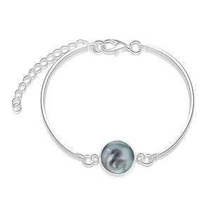 Detail of silver round bracelet with dark aurora glass inlay and adjustable lobster clasp