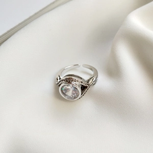 Detailed view of 925 silver ring with a large brilliant round solitaire and micro pavé