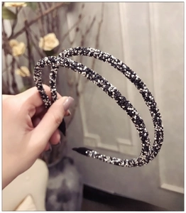 Close-up of double-layer headband with black and silver rhinestones and anti-slip tips
