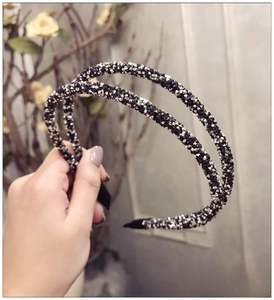 Detail of double-layer headband with black and silver crystals and anti-slip tips