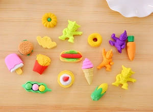 Macro shot of 14-piece set of cartoon erasers featuring mini food and character shapes