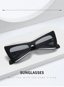 Detail view of black rectangular sunglasses on modern white geometric display props