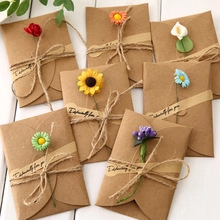 Mini kraft paper envelopes with dried flowers and twine for 3D birthday gift cards