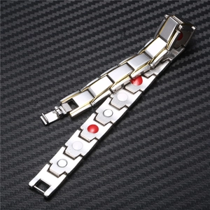 Detail of silver and gold plated magnetic therapy bracelet with functional magnets