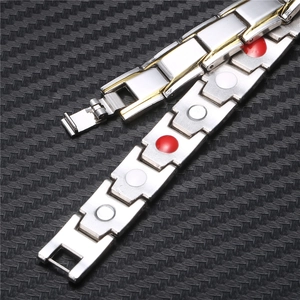 Macro detail of men's magnetic therapy bracelets in silver and gold with health magnets