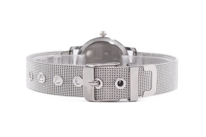 Detail view of the silver stainless steel mesh watch strap and polished metal buckle clasp