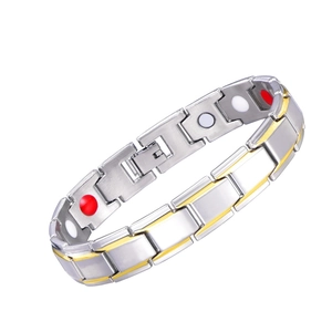 Detail of gold and silver magnetic therapy bracelet with inset health stones