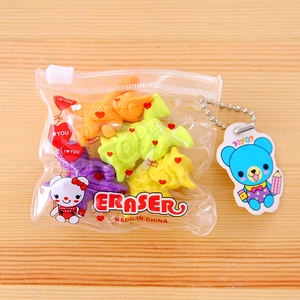 Cartoon animal eraser set in a clear PVC zipper bag with a blue bear charm on wood
