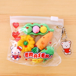 Detailed view of vegetable shaped erasers with a cartoon bear keychain in a clear pouch