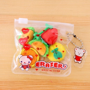 Detailed view of fruit-shaped erasers in a clear PVC pouch with a cute bear pendant
