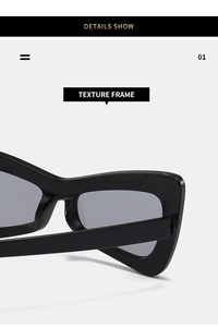 Macro shot of black thick-frame sunglasses showing texture frame and hinge detail