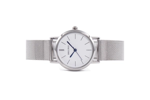 Close-up of minimalist silver mesh strap watch featuring white dial and blue hands