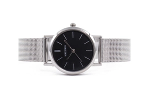 Detail view of MREURIO silver mesh strap watch with minimalist black dial and steel case