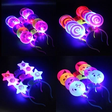 Detail showing four styles of glowing LED headbands with star and round icons