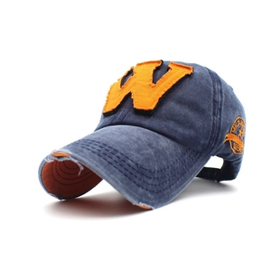 Vintage navy blue washed cotton baseball cap with embroidered orange letter W logo