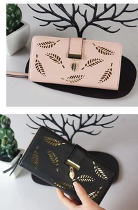 Detail of leaf hollow pattern and metal leaf pendant on long elegant ladies wallets