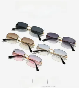 Detailed close-up of rimless Y2K sunglasses showing golden metal frame and five lens colors