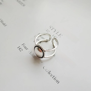 Close-up of vintage 925 sterling silver ring with double band and woven edge details