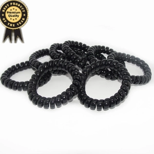 Detail of black spiral hair coils with elastic resin material and glossy finish