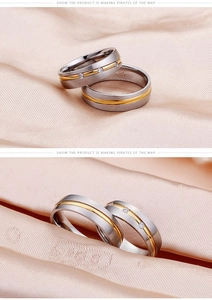 Detail of two-tone stainless steel couple rings with three-stone inlay and brushed finish