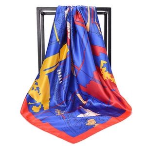 Detailed drape of a blue and red vintage map print satin silk scarf on a black hanger