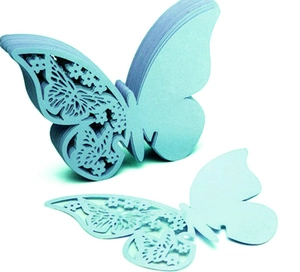 Detail showing the intricate laser-cut镂空 floral patterns on light blue butterfly place cards