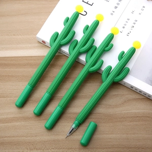 Detailed view of four cactus-shaped gel pens with soft green texture on a wooden desk