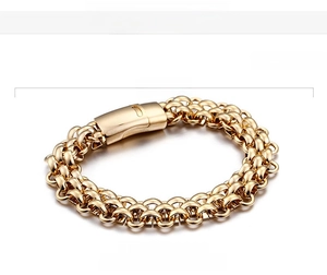Macro detail of 13mm wide gold braided stainless steel chain bracelet with specs