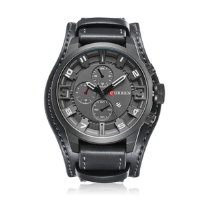 Detail shot of men's watch featuring a dark grey dial and black leather strap with backing