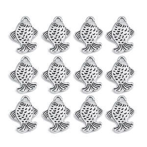 Macro detail of twelve silver metal fish charms with jump rings in a grid layout