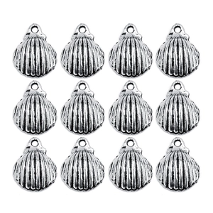 Macro detail of twelve antique silver shell alloy pendants for jewelry making