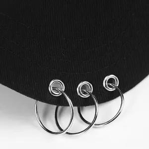 Black cotton baseball cap featuring three silver metal rings on the brim in punk style