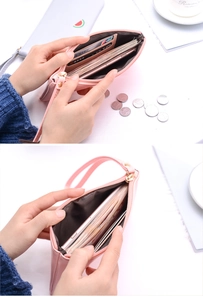 Internal view of pink double zipper wallet showing large capacity for phone and cards