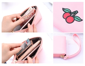 Pink PU leather clutch featuring cherry embroidery and spacious internal compartments