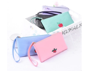 Stack of colorful PU leather fruit pouches with wristlets in pink, blue, and mint green