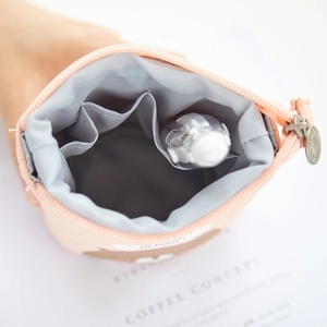 Pink canvas telescopic pencil case with zipper and interior pockets for stationery