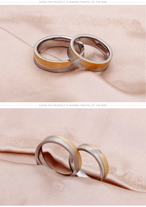 Macro view of two-tone matte titanium rings with brushed finish and inlaid crystals