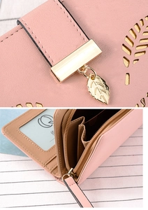 Detail of pink leaf purse showing hollow pattern, gold leaf pendant and card slots