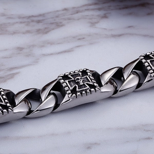 Gothic Pharaoh skull stainless steel bracelet for men with Cuban chain on white marble
