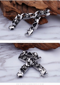 Detail view of gothic skull links on men's stainless steel bracelet with vintage clasp